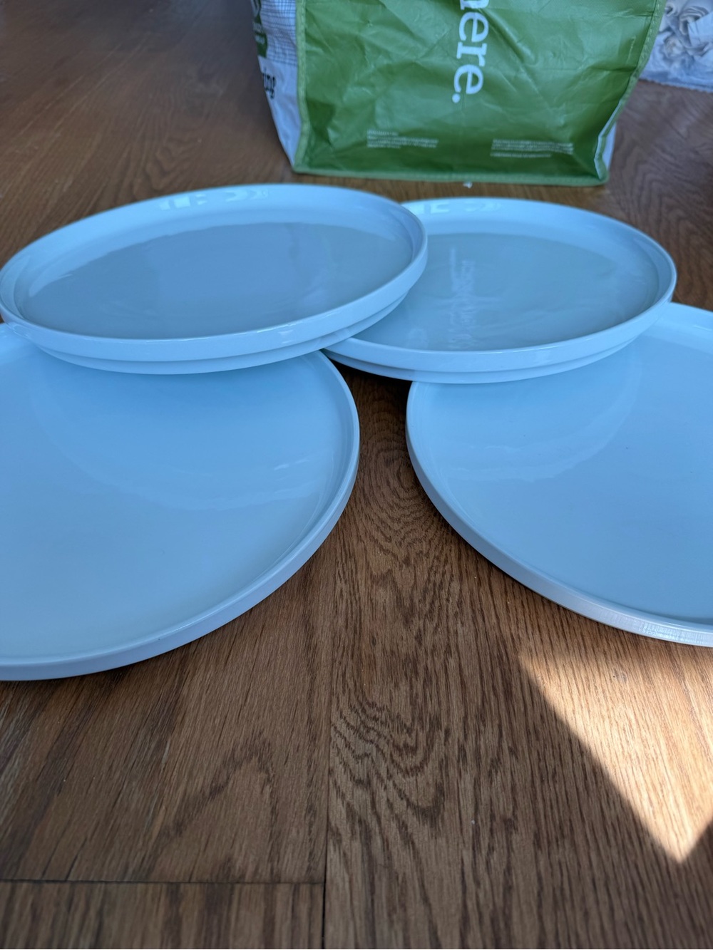 Set of 4 CB2 white ceramic dinner plates w/ lip